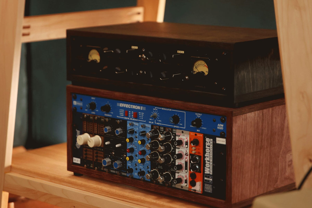2U Charcoal and 4U Caramel desktop studio racks on a studio shelf
