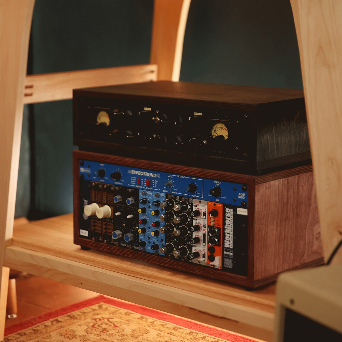 2U Charcoal and 4U Caramel desktop studio racks stacked on a studio shelf
