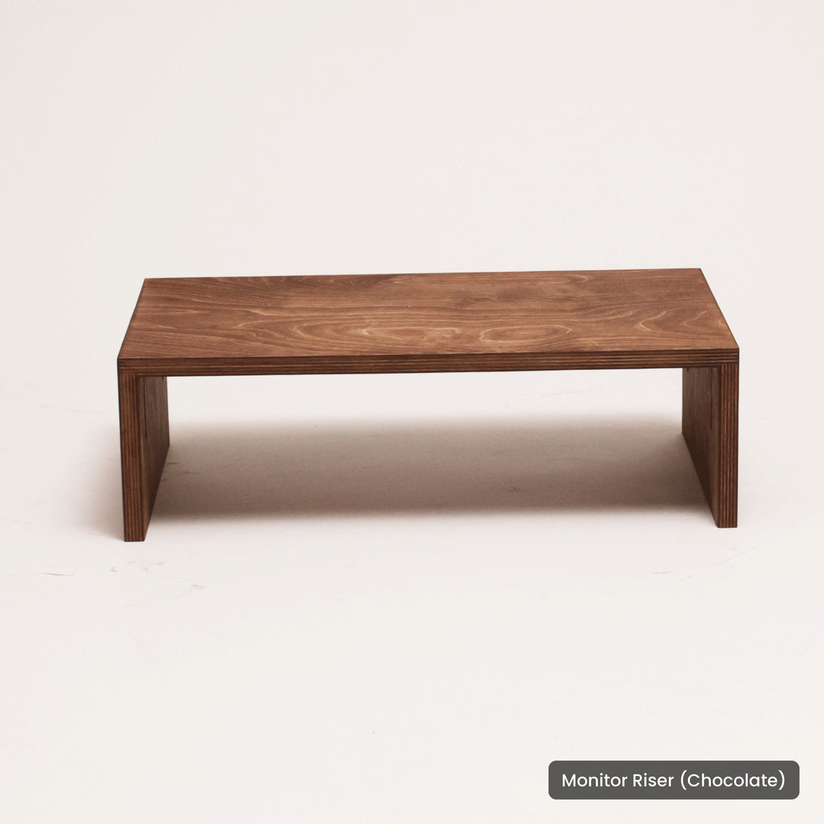 Handmade wood Monitor Riser (Chocolate), on a white background