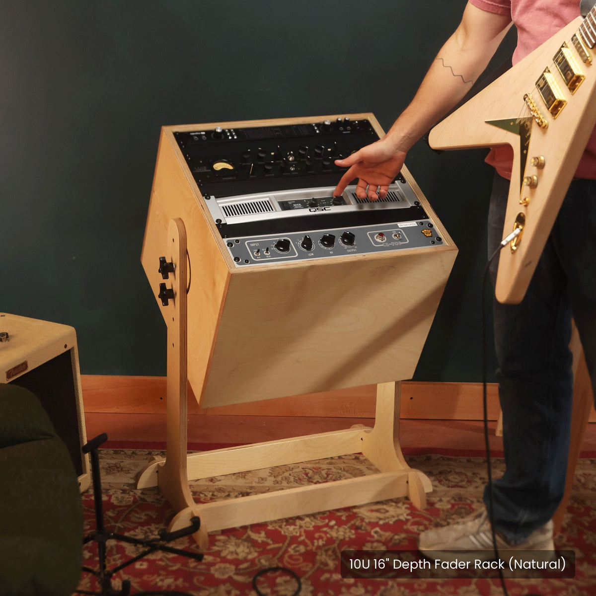 Musician reaching gear on The Fader rack tilted up toward him