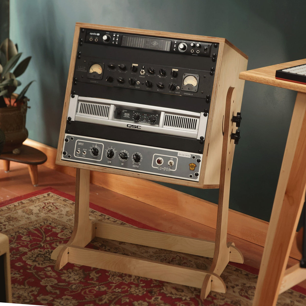 The Fader adjustable studio rack on its stand in a recording studio, loaded with rack gear